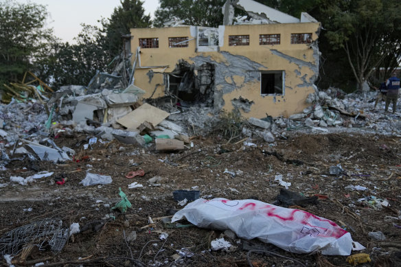 A Hamas militant in a body bag at Kibbutz Be’eri in southern Israel on October 11.